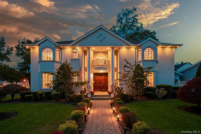 a front view of house with yard and green space