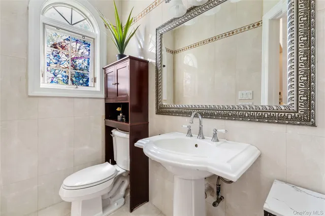 a kitchen with refrigerator a sink a stove a microwave and cabinets