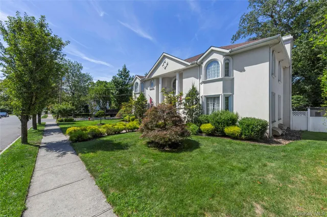 a view of a chair and table in patio with potted plants