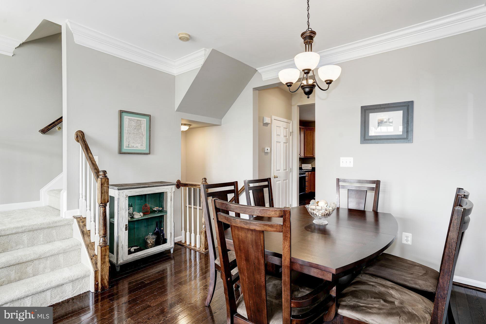 25013 Riding Center Drive Chantilly, VA 20152 - Photo 12 of 28 a view of a dining room with furniture and wooden floor