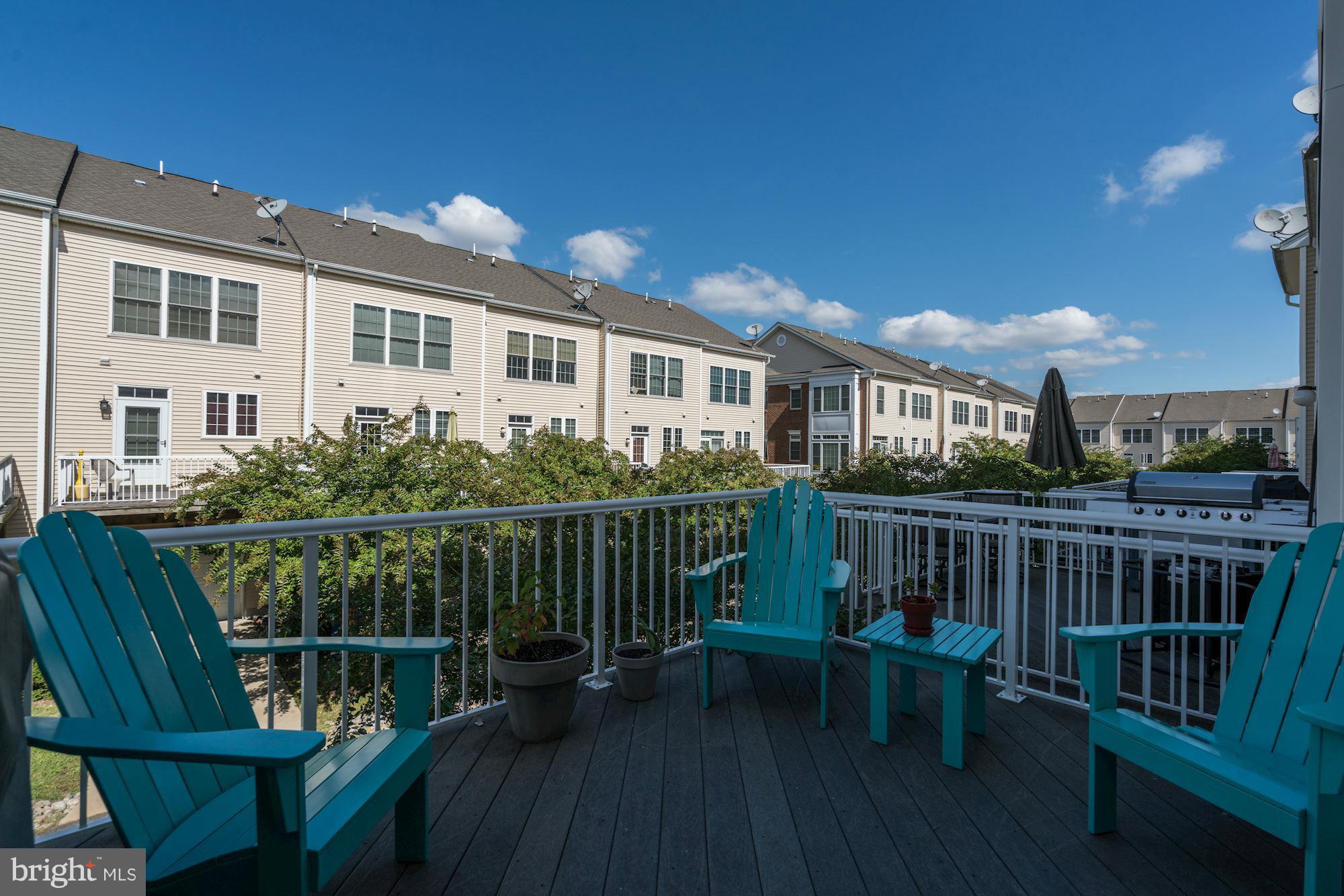 25013 Riding Center Drive Chantilly, VA 20152 - Photo 25 of 28 a view of a chair and table in the balcony