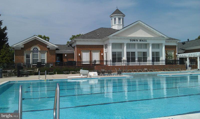 25013 Riding Center Drive Chantilly, VA 20152 - Photo 27 of 28 a front view of a house with a yard