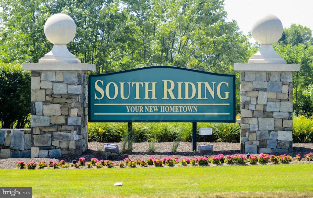 25013 Riding Center Drive Chantilly, VA 20152 - Photo 28 of 28 a front view of a house with garden