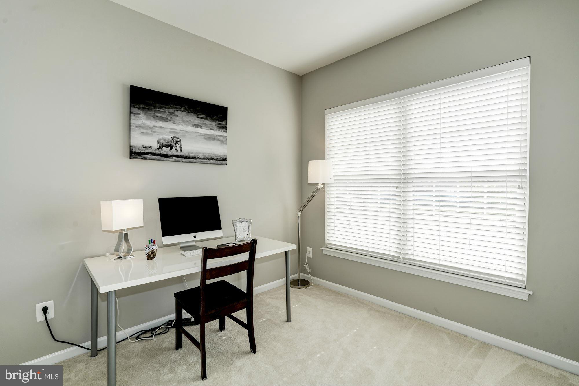 25013 Riding Center Drive Chantilly, VA 20152 - Photo 4 of 28 a view of a workspace with a window