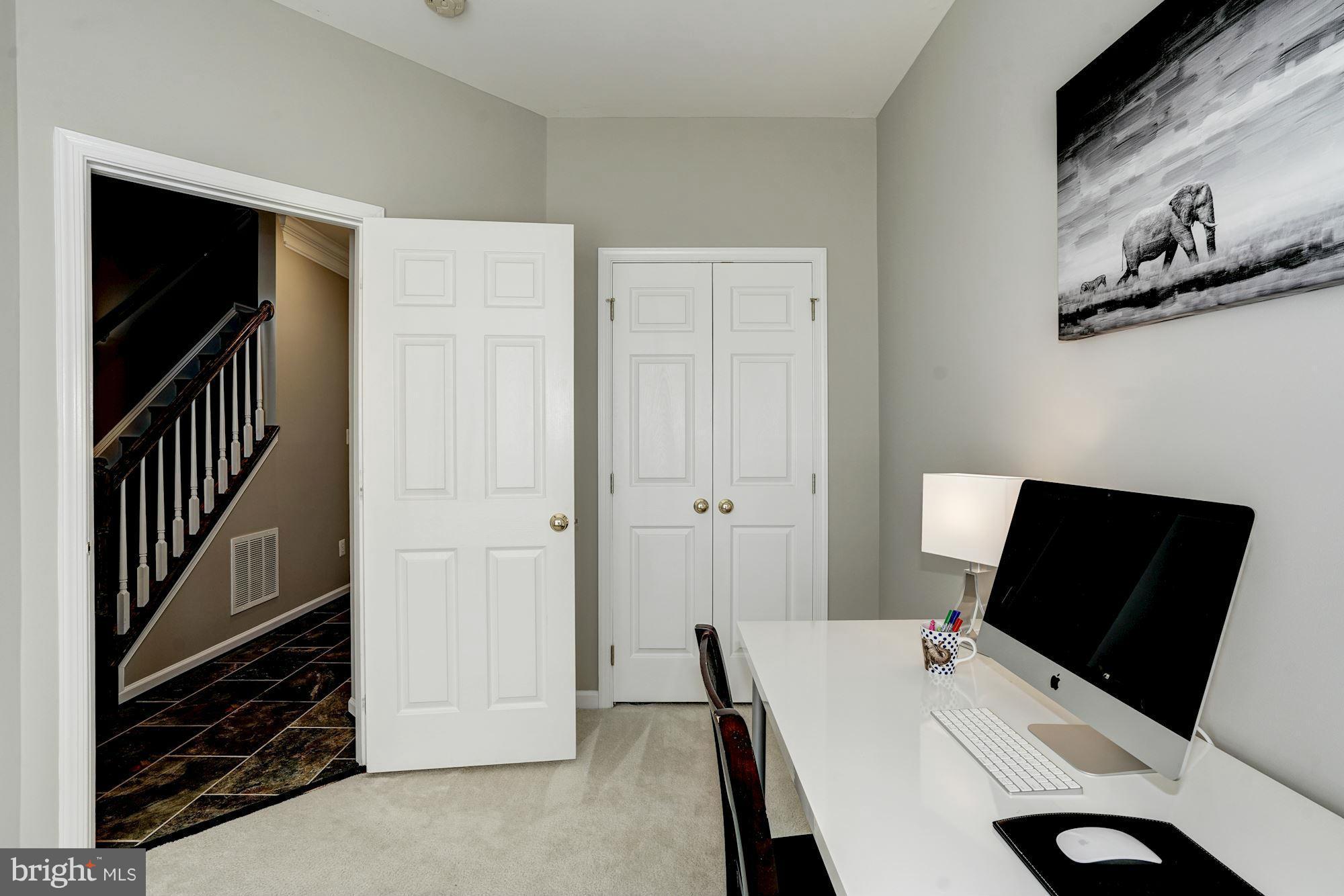 25013 Riding Center Drive Chantilly, VA 20152 - Photo 5 of 28 a view of a workspace with furniture and a window