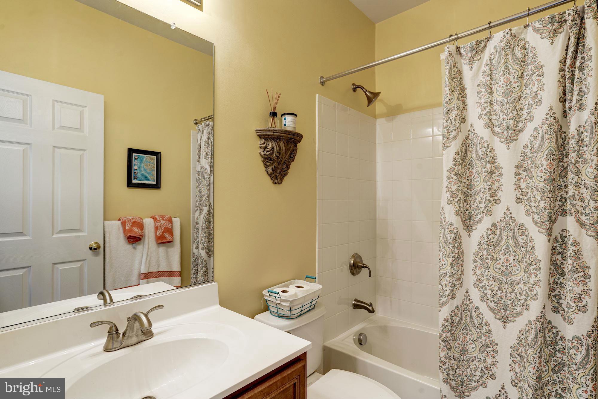 25013 Riding Center Drive Chantilly, VA 20152 - Photo 6 of 28 a bathroom with a sink and a mirror