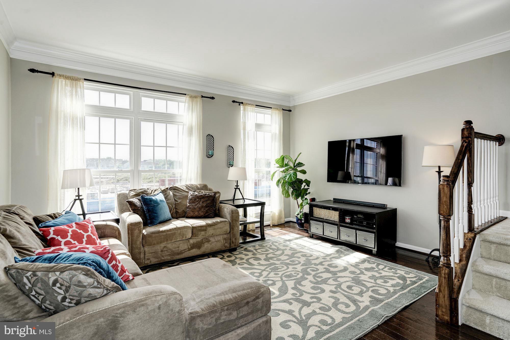 25013 Riding Center Drive Chantilly, VA 20152 - Photo 7 of 28 a living room with furniture fireplace and a flat screen tv