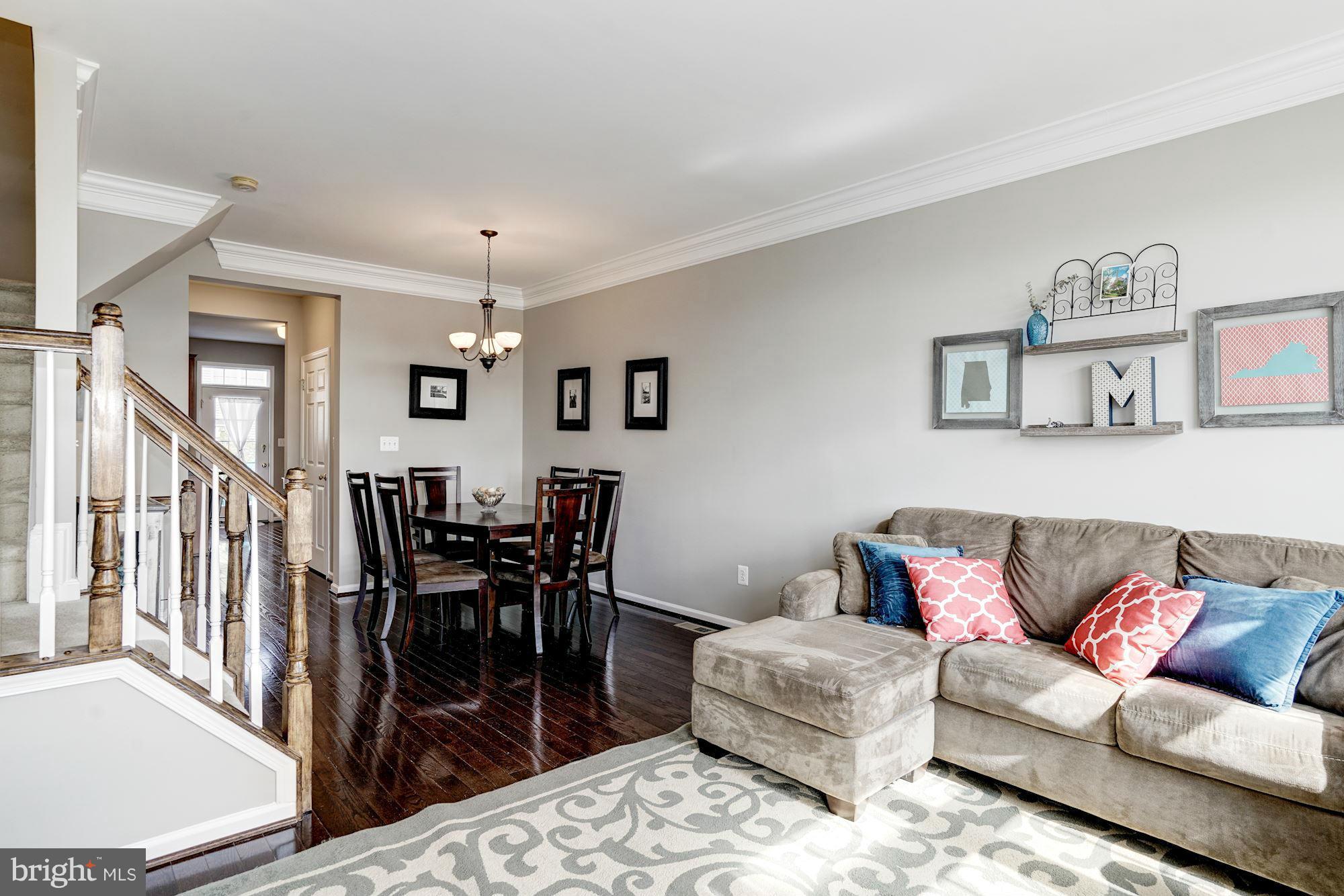 25013 Riding Center Drive Chantilly, VA 20152 - Photo 9 of 28 a living room with furniture and wooden floor