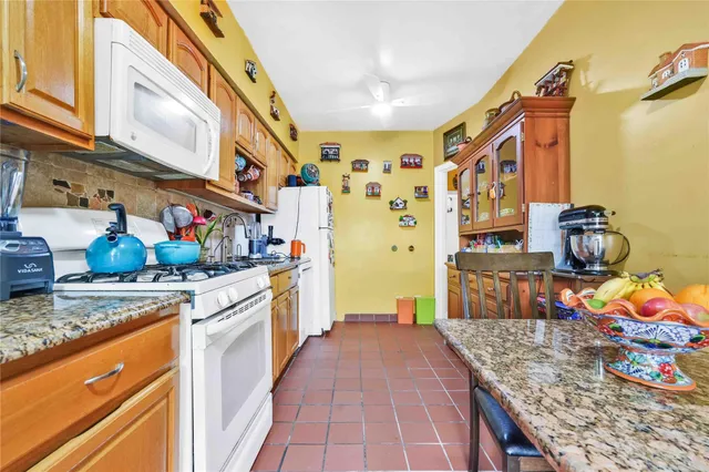 a bathroom with a sink a mirror and shower curtain