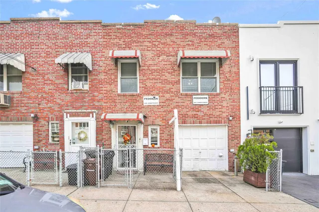 a front view of a house with parking