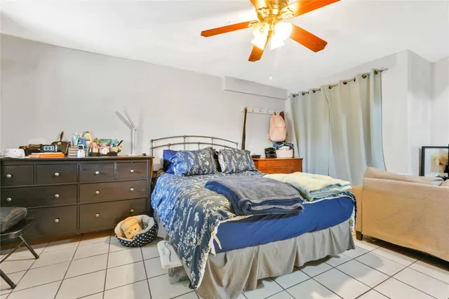 a kitchen with sink refrigerator dining table and chairs
