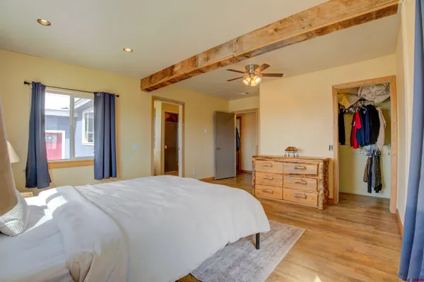a bedroom with a bed and a dresser