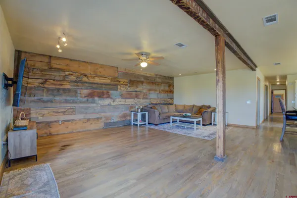 a view of livingroom with furniture and wooden floor