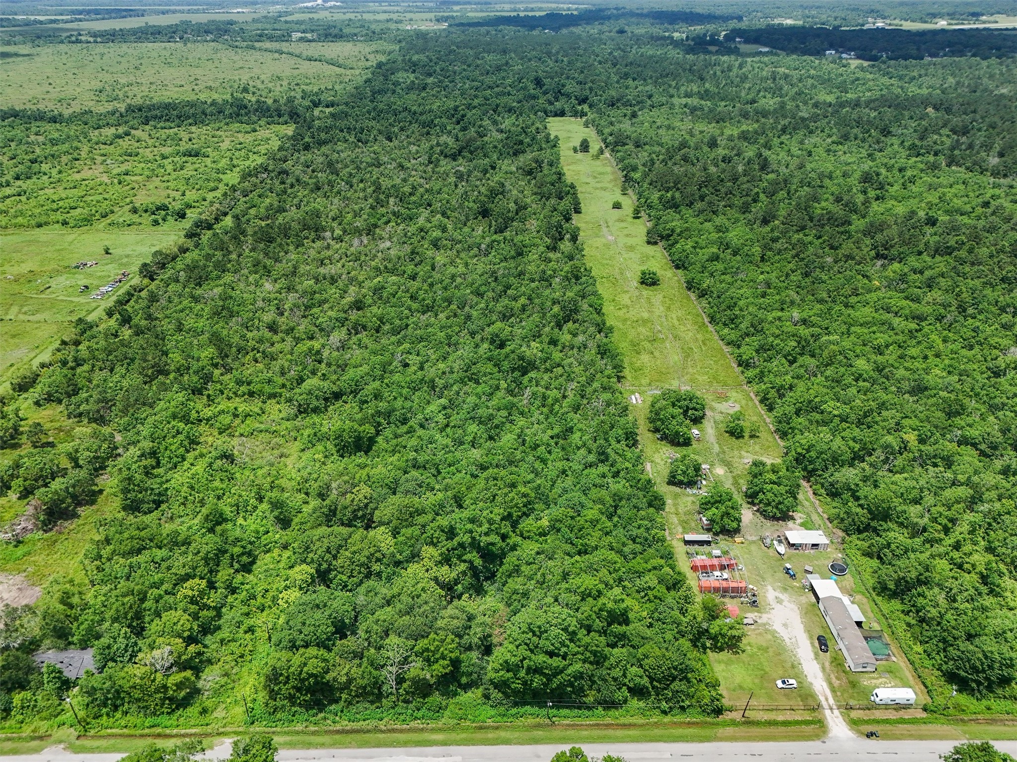 182 County Road 182 Liberty, TX 77575 - Photo 7 of 9 a view of a yard with a tree
