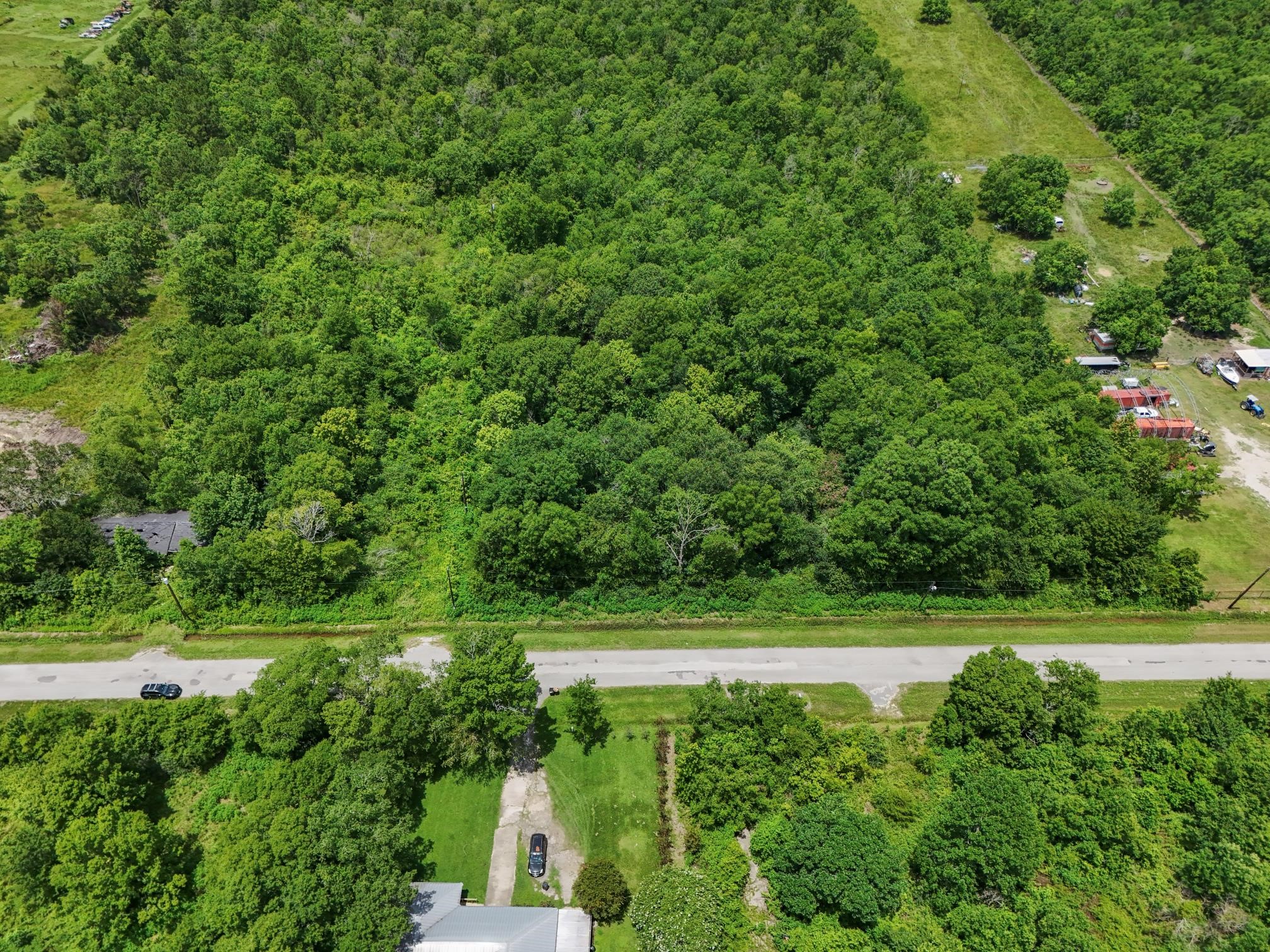 182 County Road 182 Liberty, TX 77575 - Photo 9 of 9 a view of a lush green space