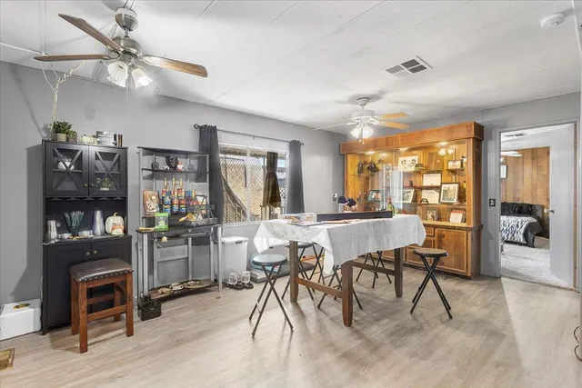 a room with lots of chairs and mirrors