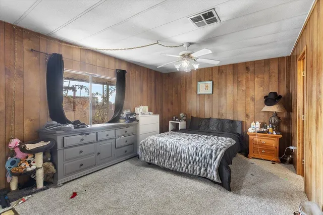 a bedroom with a bed and a mirror