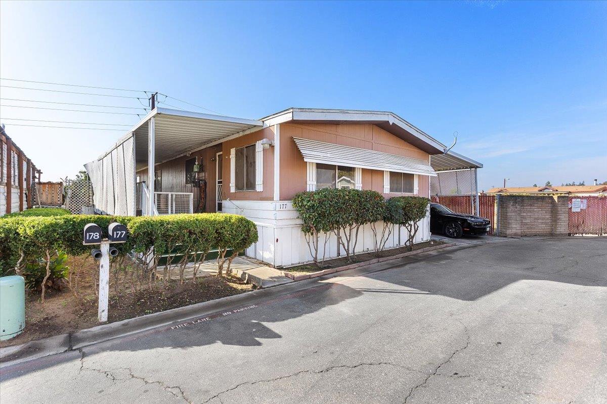 4837 Faith Home Road, Unit 177 Ceres, CA 95307 - Photo 2 of 31 a front view of a house with garden