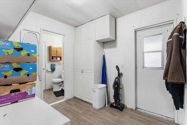 a view of room with toys and wooden floor