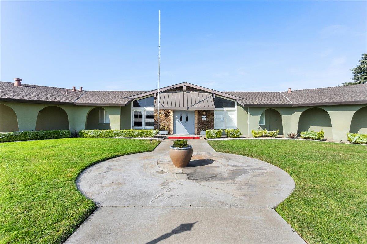 4837 Faith Home Road, Unit 177 Ceres, CA 95307 - Photo 29 of 31 a view of a house with a yard