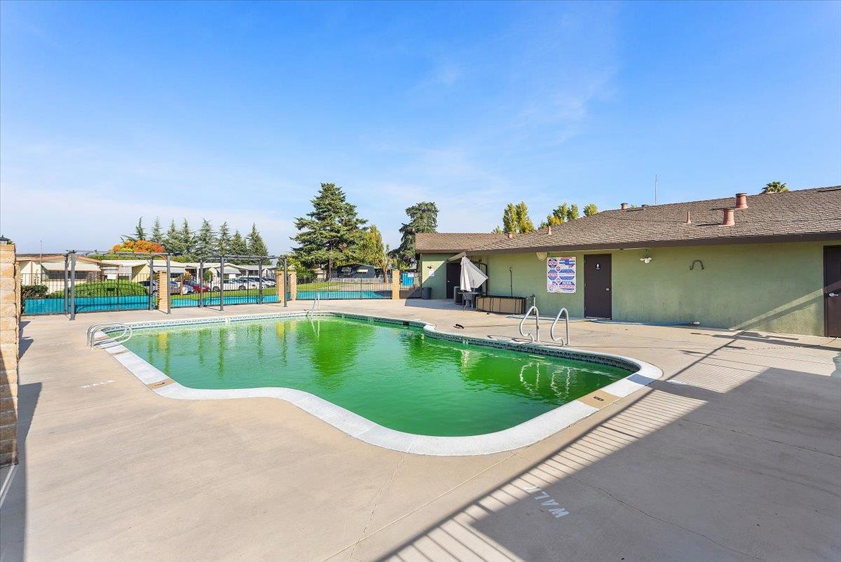 4837 Faith Home Road, Unit 177 Ceres, CA 95307 - Photo 30 of 31 a view of a swimming pool with a patio