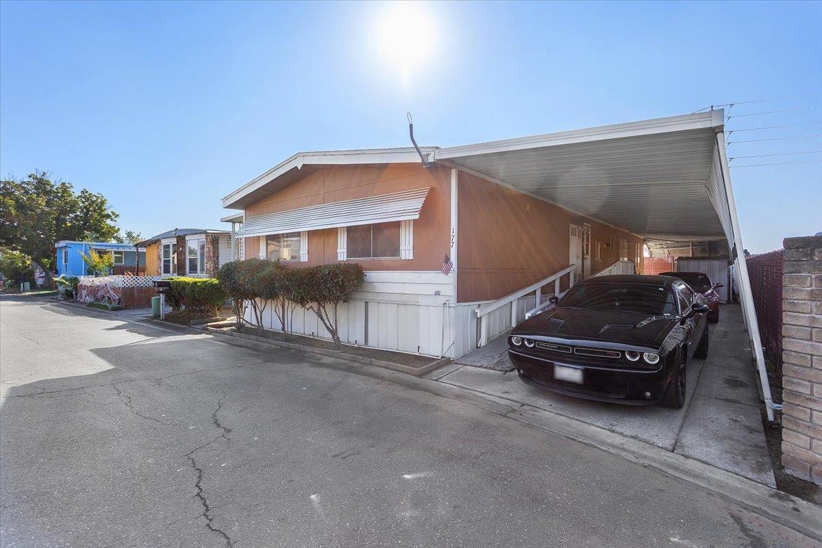 4837 Faith Home Road, Unit 177 Ceres, CA 95307 - Photo 3 of 31 a car parked in front of a house