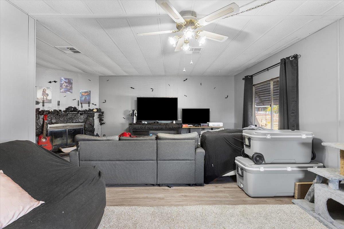 4837 Faith Home Road, Unit 177 Ceres, CA 95307 - Photo 6 of 31 a living room with furniture and a flat screen tv