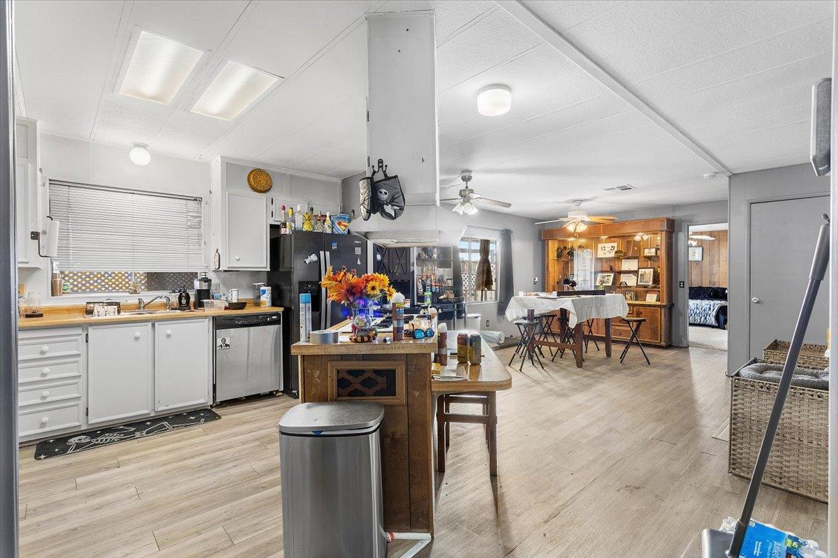 4837 Faith Home Road, Unit 177 Ceres, CA 95307 - Photo 8 of 31 a view of a kitchen with appliances and furniture