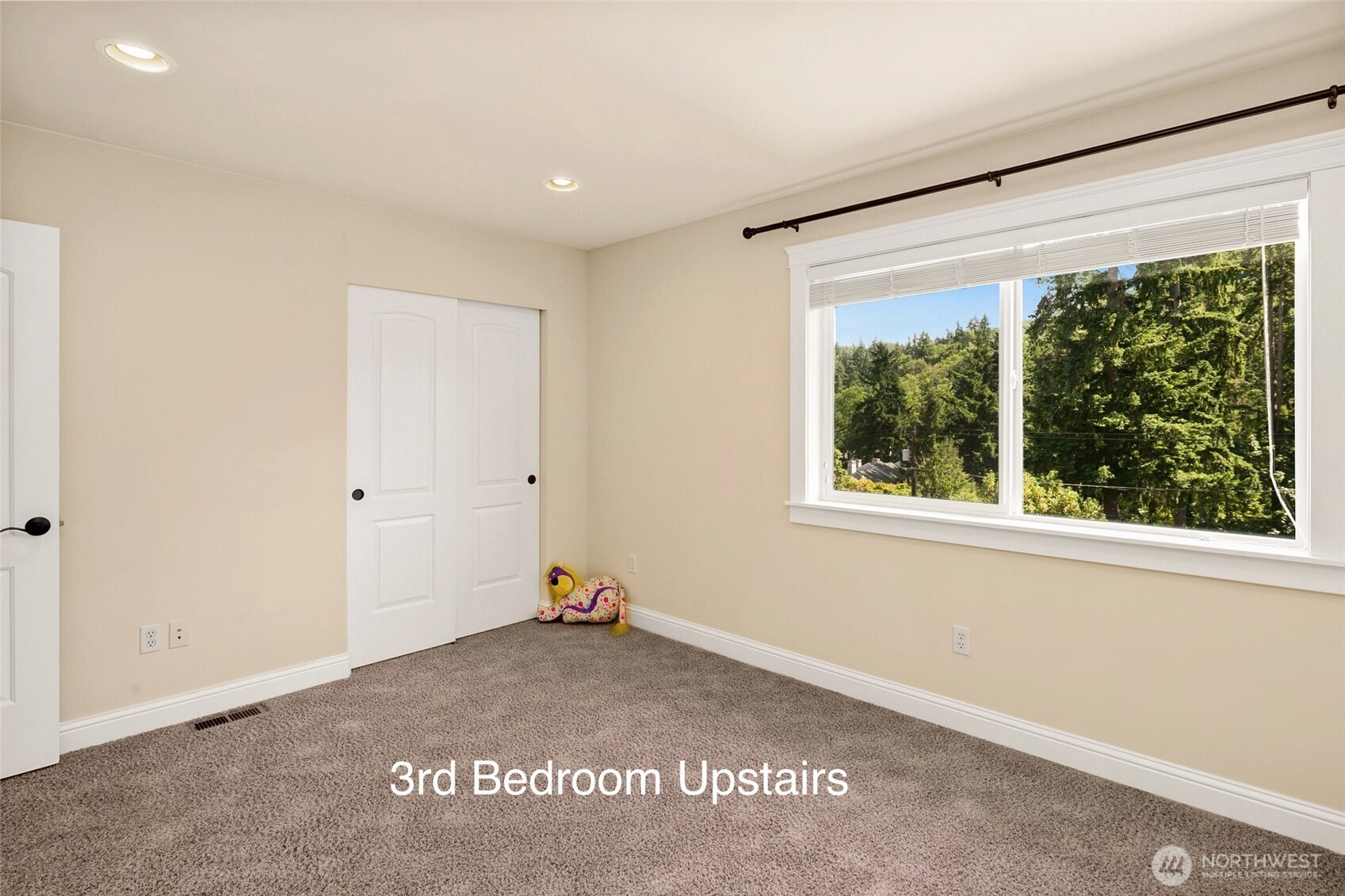 14248 Southeast Allen Rd. Bellevue, WA 98006 - Photo 25 of 40 a view of a big room with wooden floor and windows