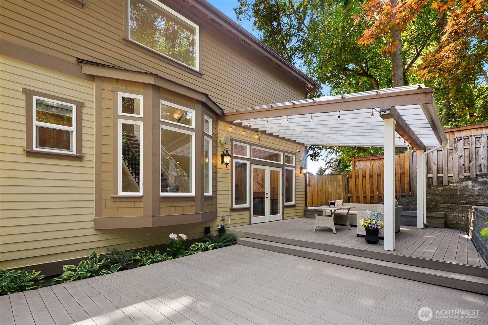 14248 Southeast Allen Rd. Bellevue, WA 98006 - Photo 33 of 40 a patio with a table and chairs and potted plants
