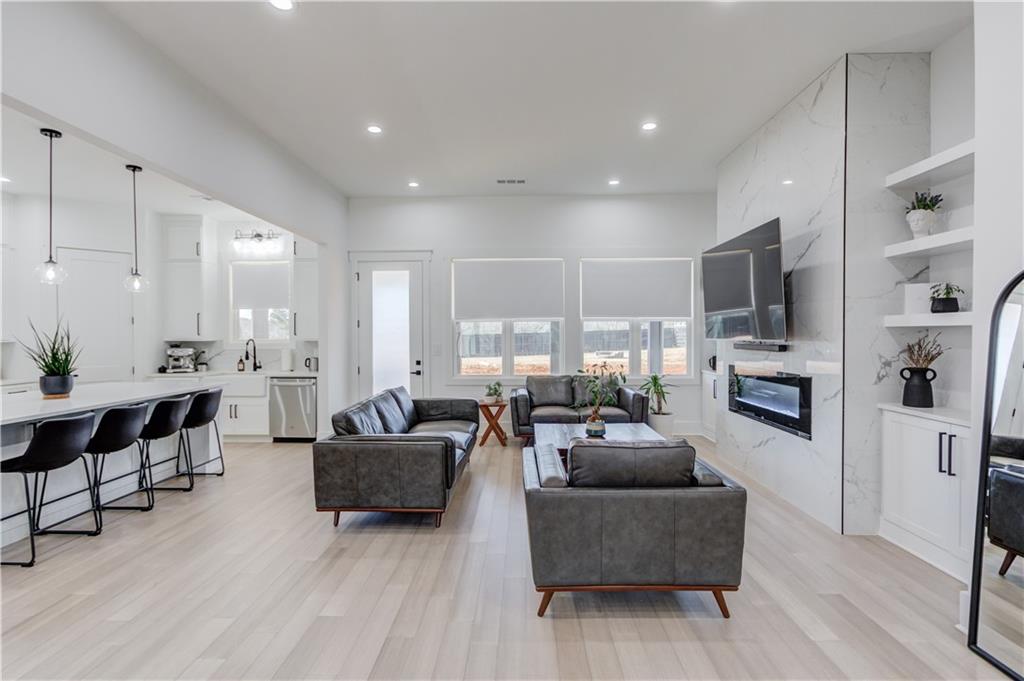 246 Pleasant Hill Church Road Northeast Winder, GA 30680 - Photo 11 of 64 a living room with fireplace furniture and a flat screen tv