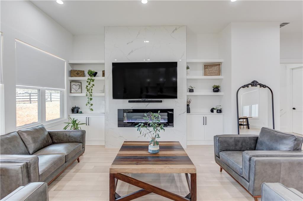 246 Pleasant Hill Church Road Northeast Winder, GA 30680 - Photo 13 of 64 a living room with furniture and a flat screen tv