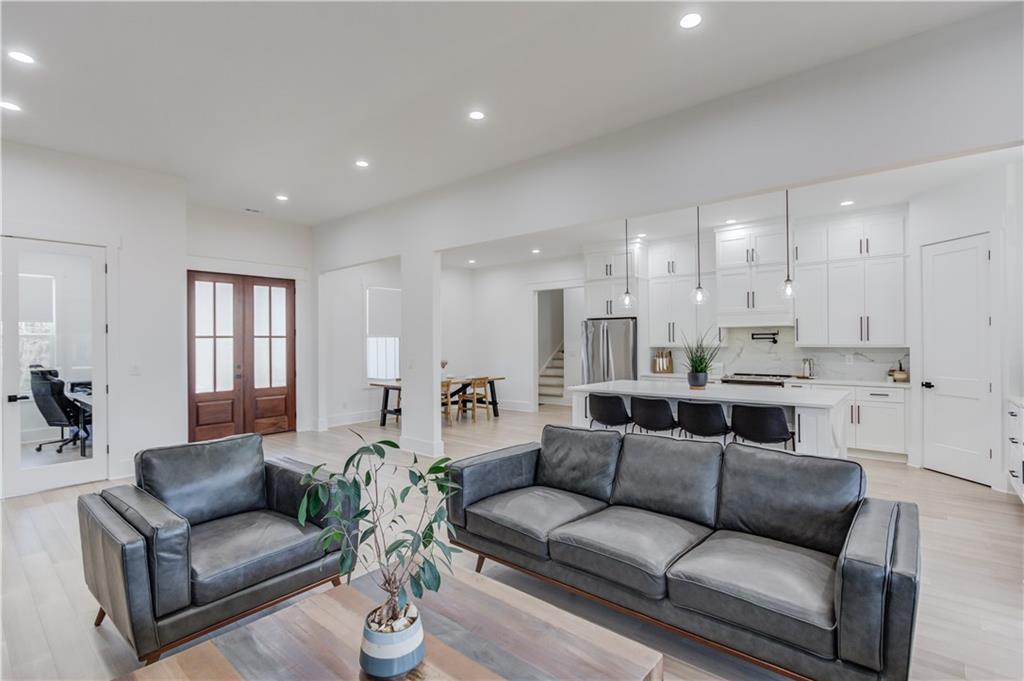 246 Pleasant Hill Church Road Northeast Winder, GA 30680 - Photo 14 of 64 a living room with furniture white walls and kitchen view