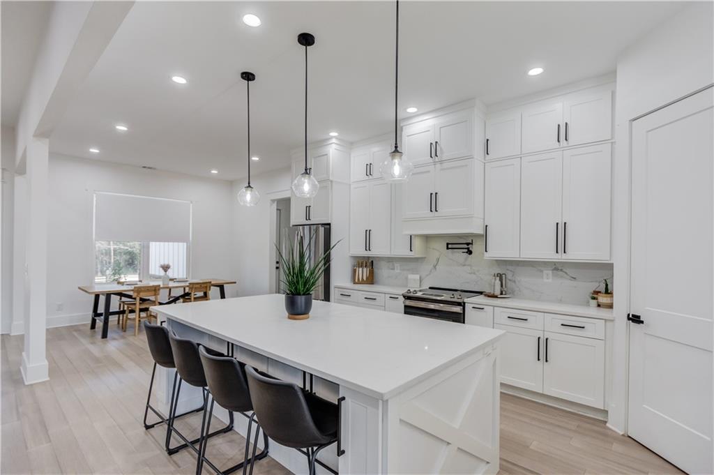 246 Pleasant Hill Church Road Northeast Winder, GA 30680 - Photo 16 of 64 a kitchen that has a lot of cabinets in it and appliances