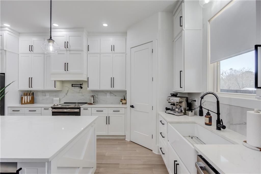 246 Pleasant Hill Church Road Northeast Winder, GA 30680 - Photo 17 of 64 a kitchen with stainless steel appliances a sink stove and refrigerator