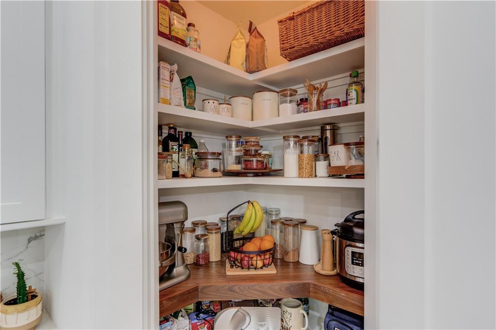 246 Pleasant Hill Church Road Northeast Winder, GA 30680 - Photo 20 of 64 a shelf with books and knick knacks on it