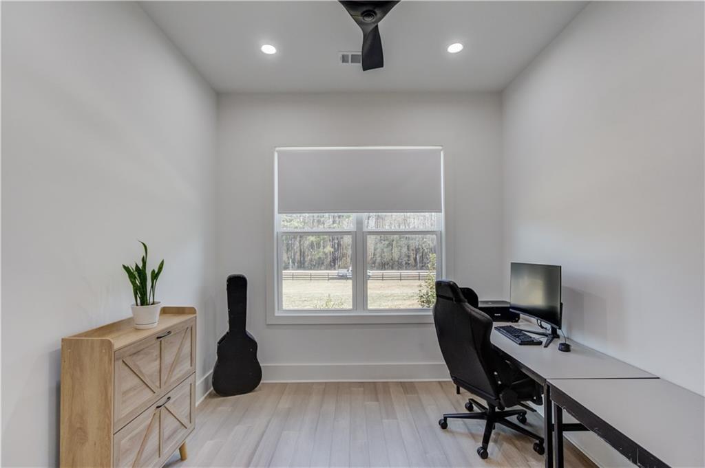 246 Pleasant Hill Church Road Northeast Winder, GA 30680 - Photo 21 of 64 a workspace with furniture hardwood and a window