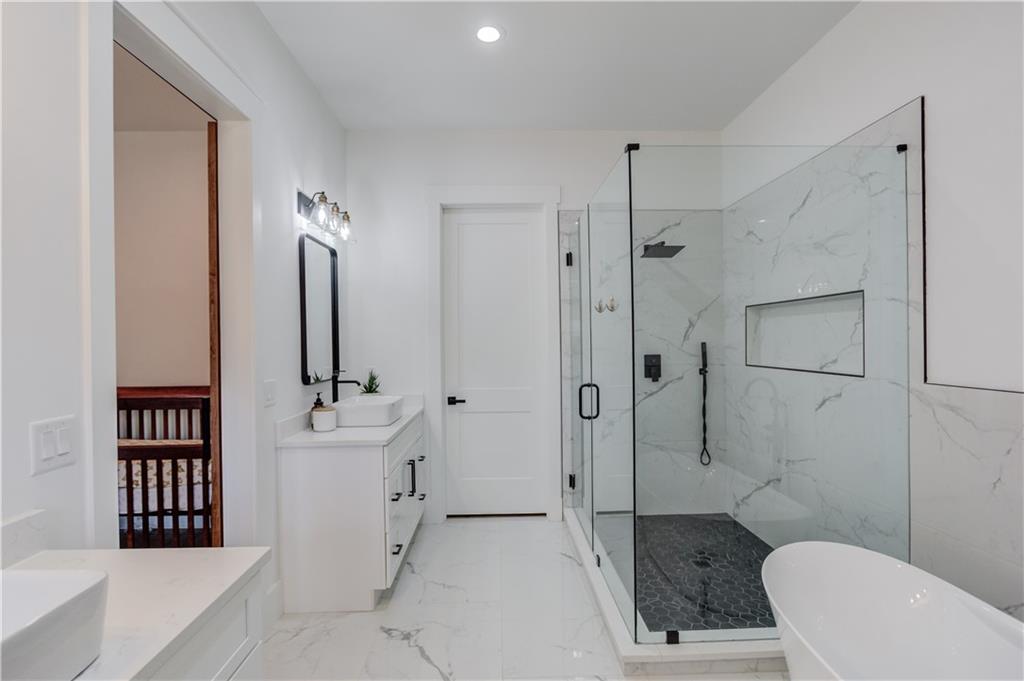 246 Pleasant Hill Church Road Northeast Winder, GA 30680 - Photo 25 of 64 a spacious bathroom with a bathtub shower sink mirror and toilet