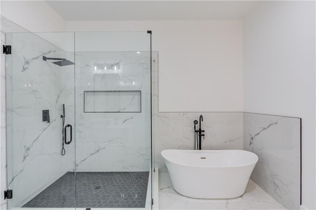 246 Pleasant Hill Church Road Northeast Winder, GA 30680 - Photo 27 of 64 a bathroom with a sink a window and shower
