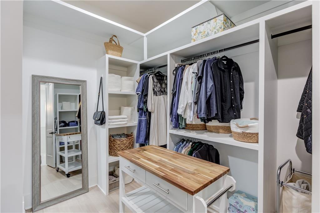 246 Pleasant Hill Church Road Northeast Winder, GA 30680 - Photo 28 of 64 a view of walk in closet with clothes and shoes