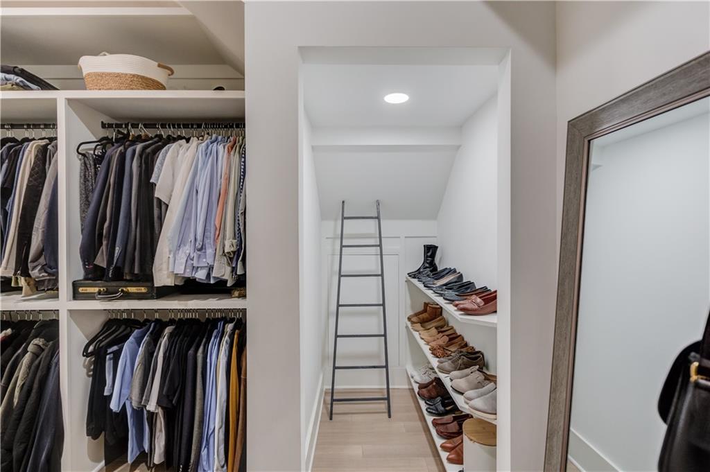246 Pleasant Hill Church Road Northeast Winder, GA 30680 - Photo 29 of 64 a view of walk in closet with clothes and shoes