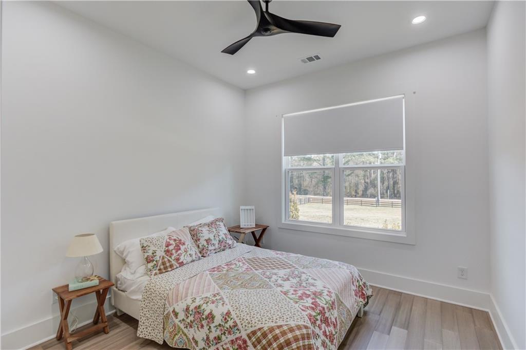 246 Pleasant Hill Church Road Northeast Winder, GA 30680 - Photo 34 of 64 a bedroom with a bed and a window