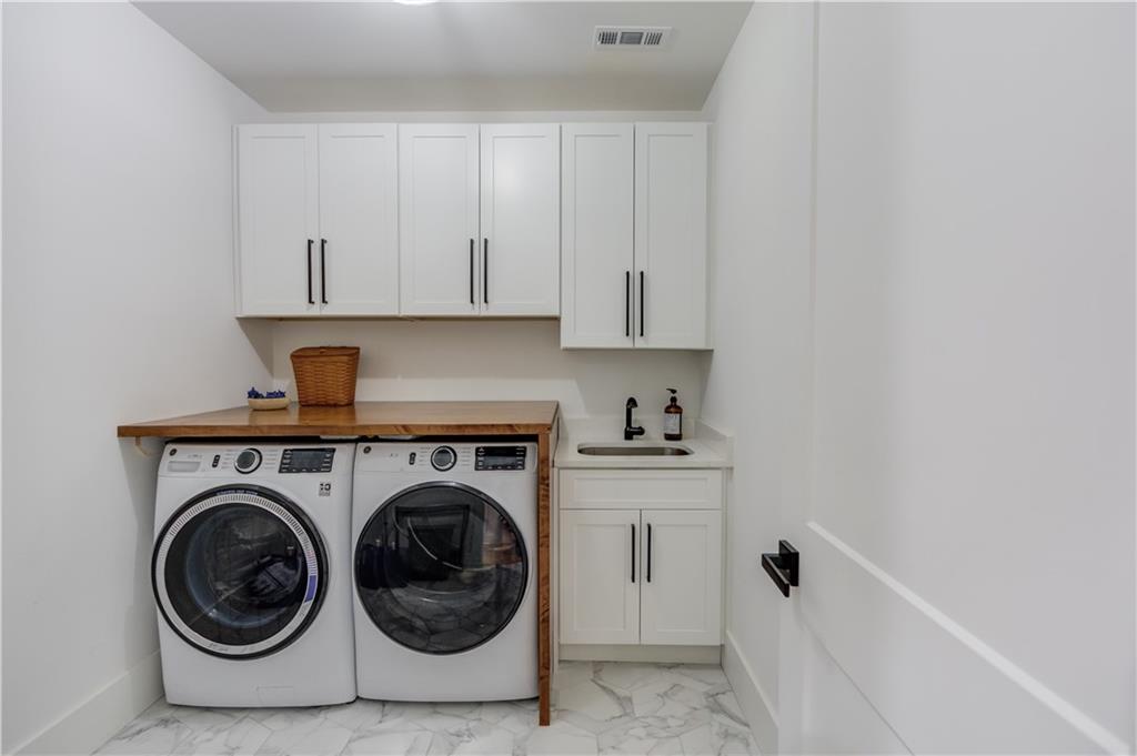 246 Pleasant Hill Church Road Northeast Winder, GA 30680 - Photo 38 of 64 a utility room with sink dryer and washer
