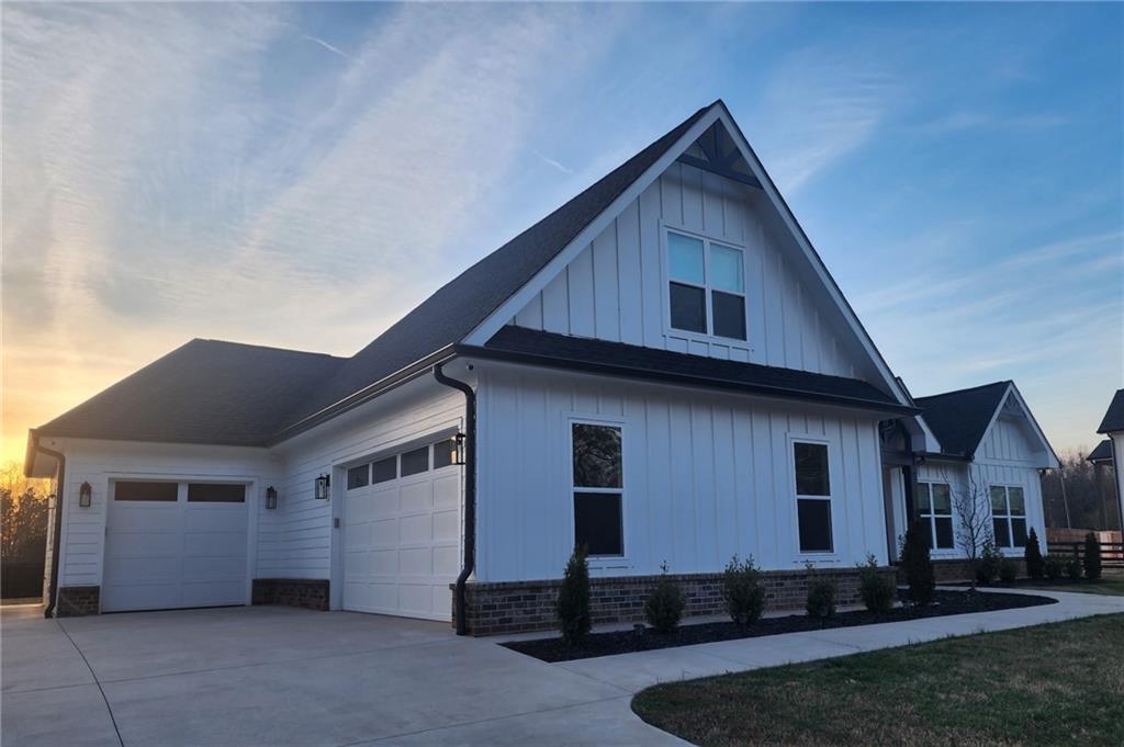 246 Pleasant Hill Church Road Northeast Winder, GA 30680 - Photo 4 of 64 a front view of a house with a yard