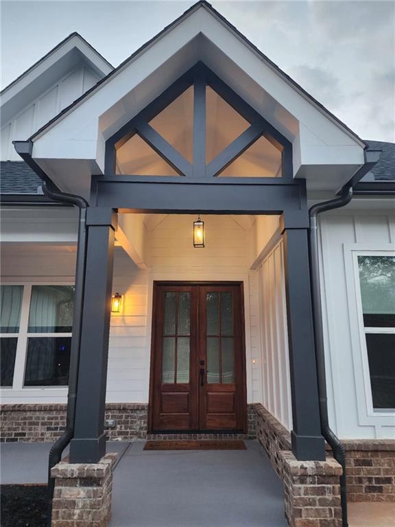246 Pleasant Hill Church Road Northeast Winder, GA 30680 - Photo 5 of 64 a front view of a house with a window