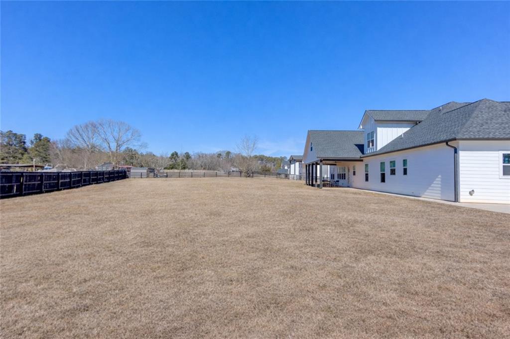 246 Pleasant Hill Church Road Northeast Winder, GA 30680 - Photo 59 of 64 a view of a house with a yard and mountain view