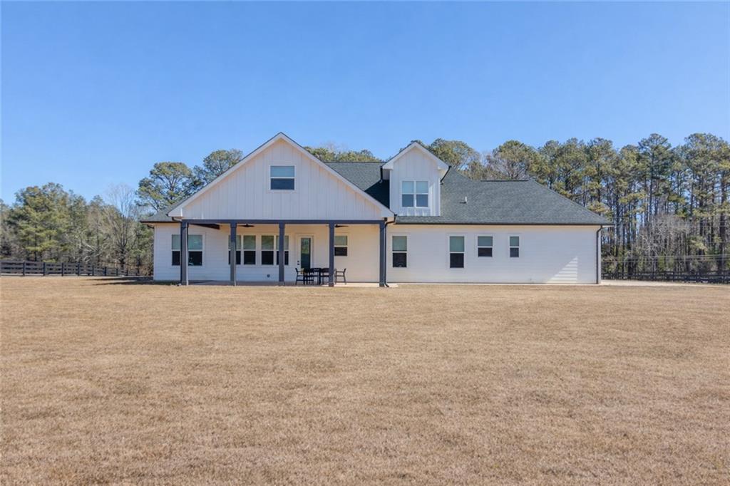 246 Pleasant Hill Church Road Northeast Winder, GA 30680 - Photo 60 of 64 a front view of house with yard and trees in the background