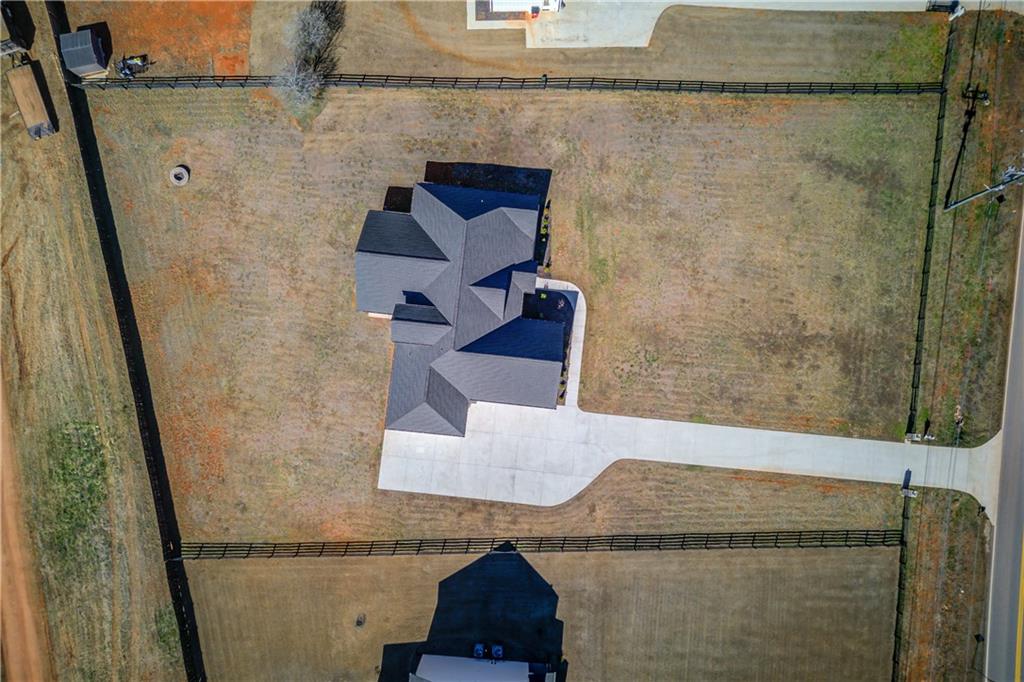 246 Pleasant Hill Church Road Northeast Winder, GA 30680 - Photo 64 of 64 a bathroom with a granite countertop sink a mirror and shower