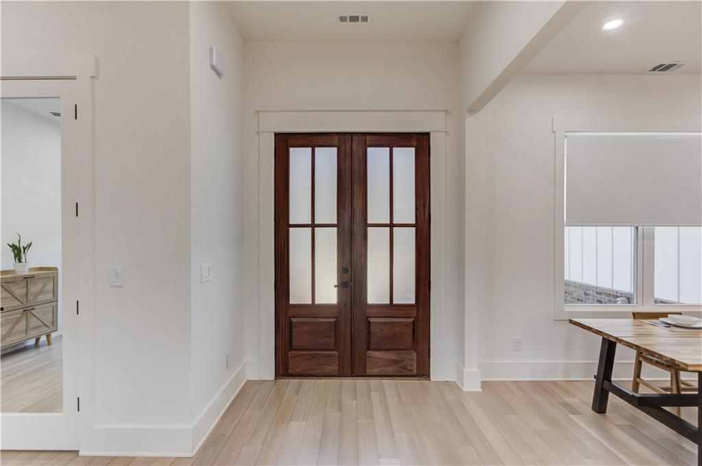 246 Pleasant Hill Church Road Northeast Winder, GA 30680 - Photo 8 of 64 a view of a hallway with wooden floor and staircase