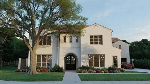 a front view of a house with a garden